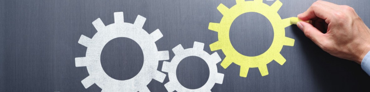 Closeup of someone drawing cogs on glass with a marker pen