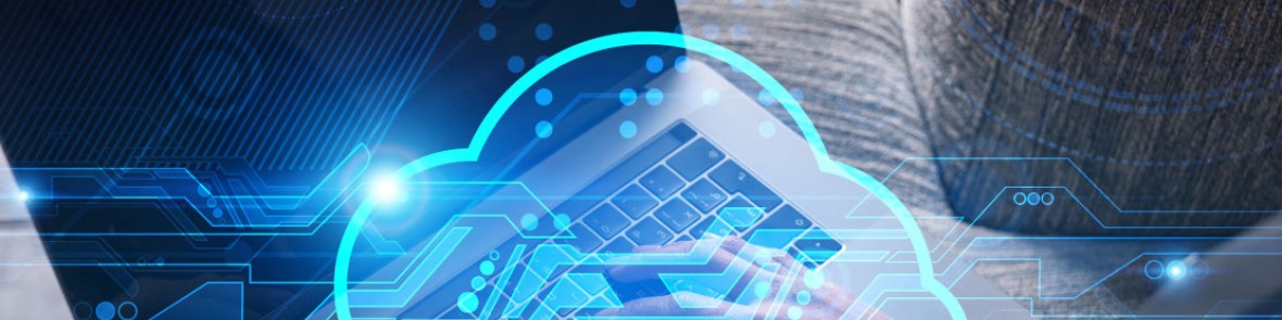 Laptop on a wooden table with cloud graphics